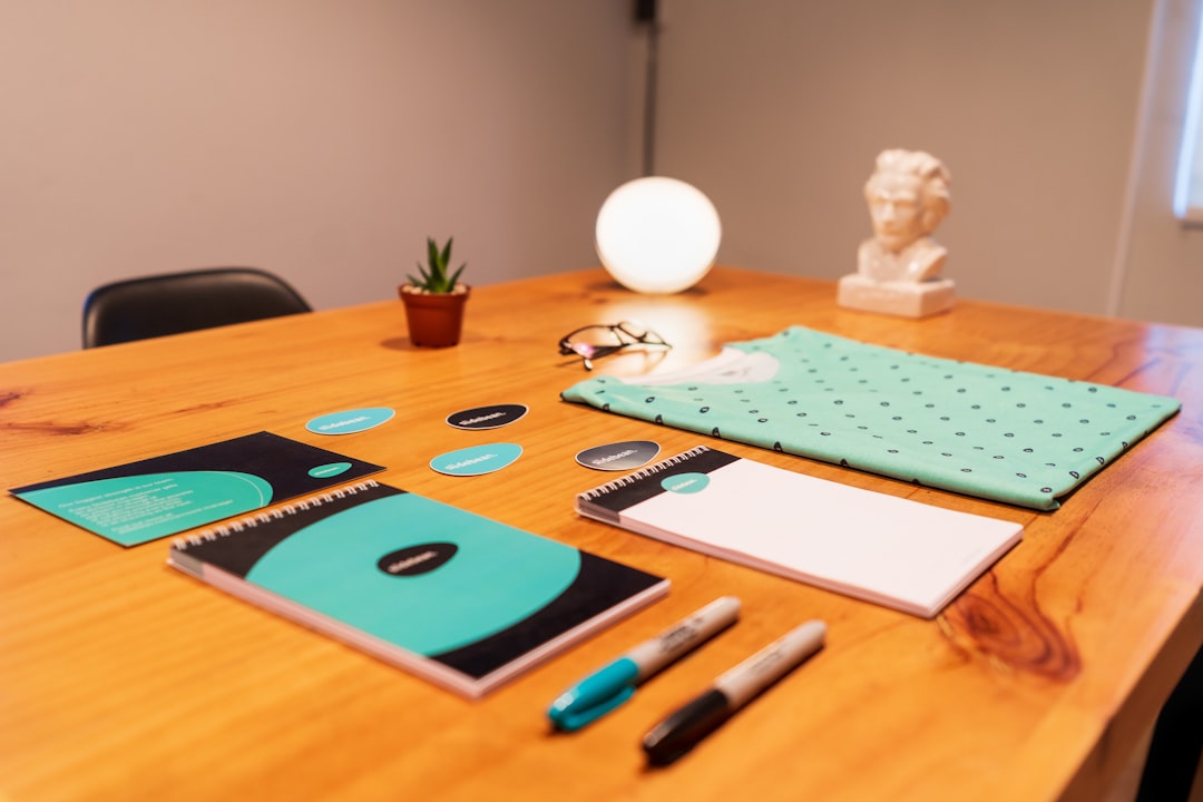 home-hero blue-and-black-click-pen-on-brown-wooden-table-y1efzwi1xyu